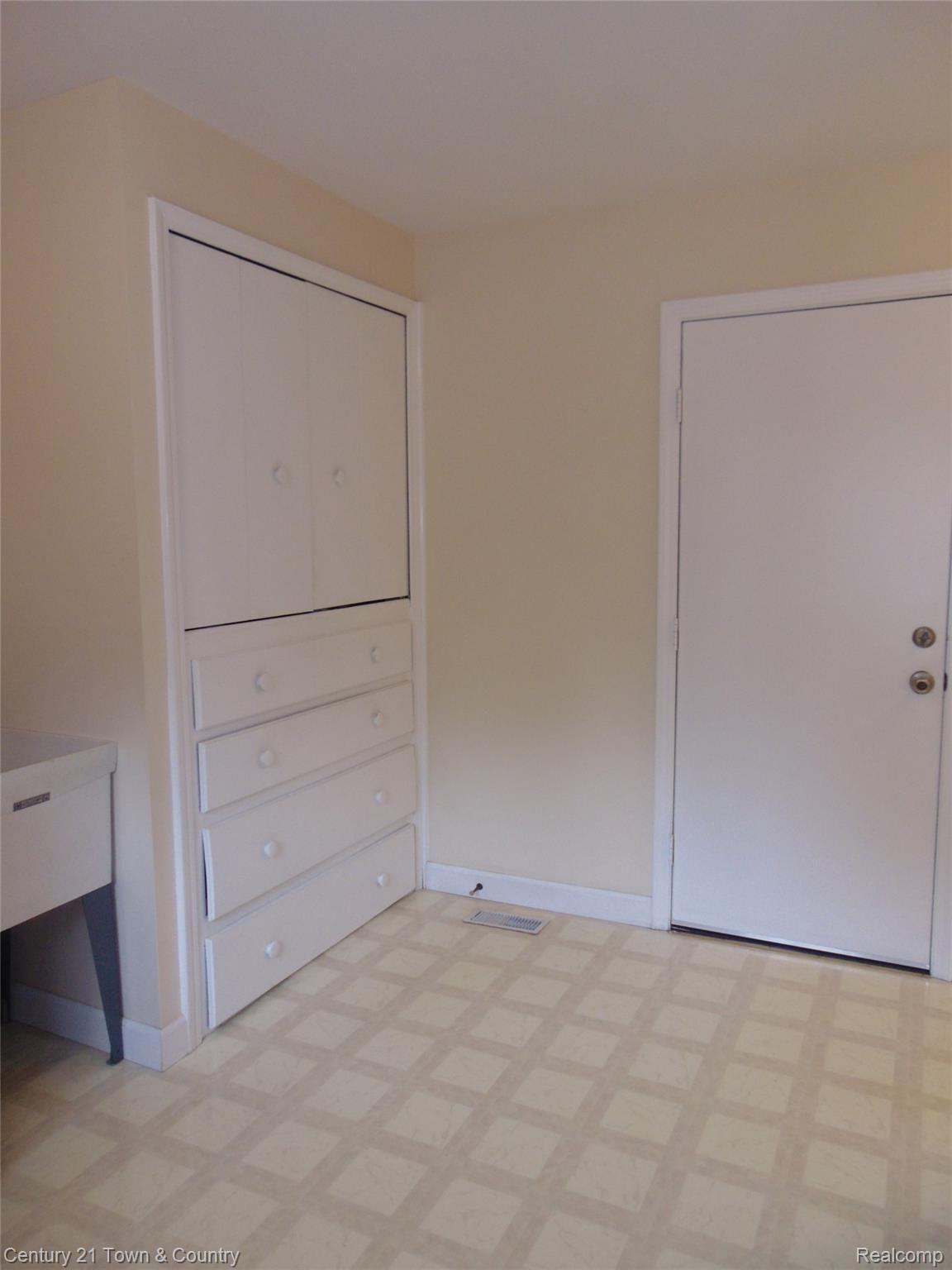 9555 Ridge Top Trail Clarkston, MI 48348 - Photo 22 of 49 Built in Storage Cabinet in the Laundry/Mud Room.....