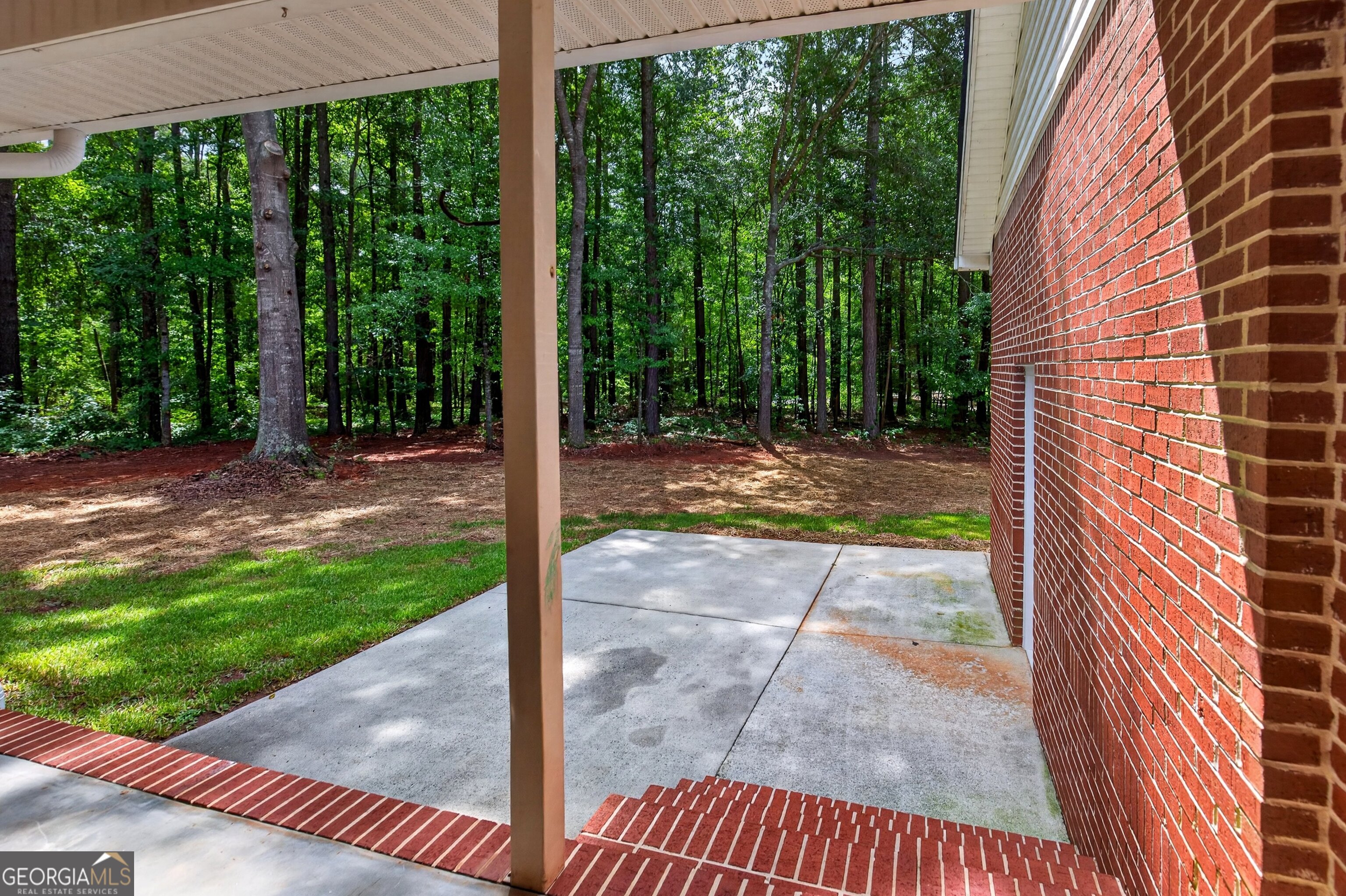 174 Rock House Road Senoia, GA 30276 - Photo 30 of 41 a view of a backyard with a garden