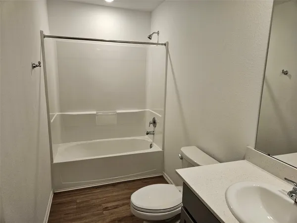a bathroom with a toilet and a sink