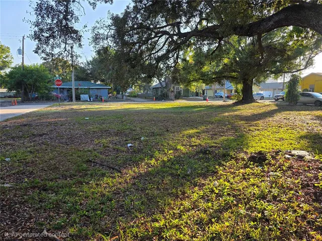 a view of yard with swimming pool and trees