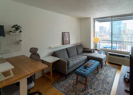 a living room with furniture and a window