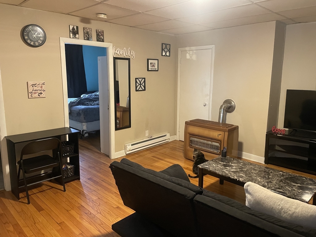 306-308 4th Street Fall River, MA 02721 - Photo 4 of 6 a living room with furniture and a flat screen tv