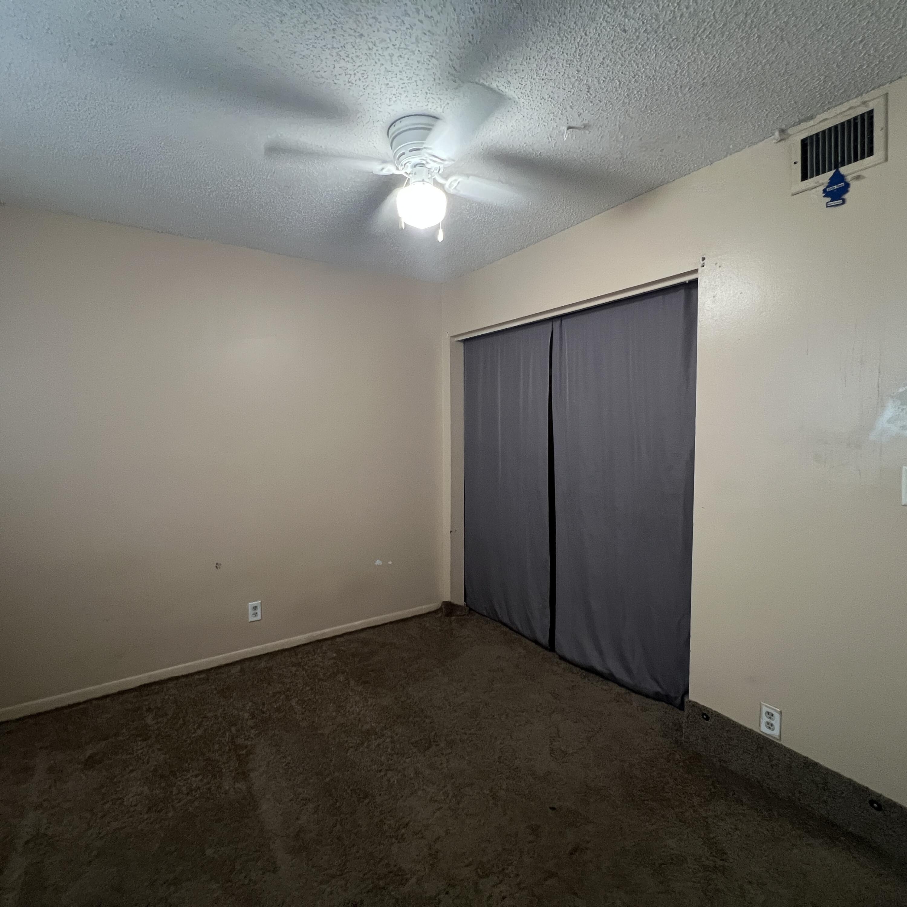 2141 Woolbright Road, Unit L204 Boynton Beach, FL 33426 - Photo 11 of 18 an empty room with a chandelier fan