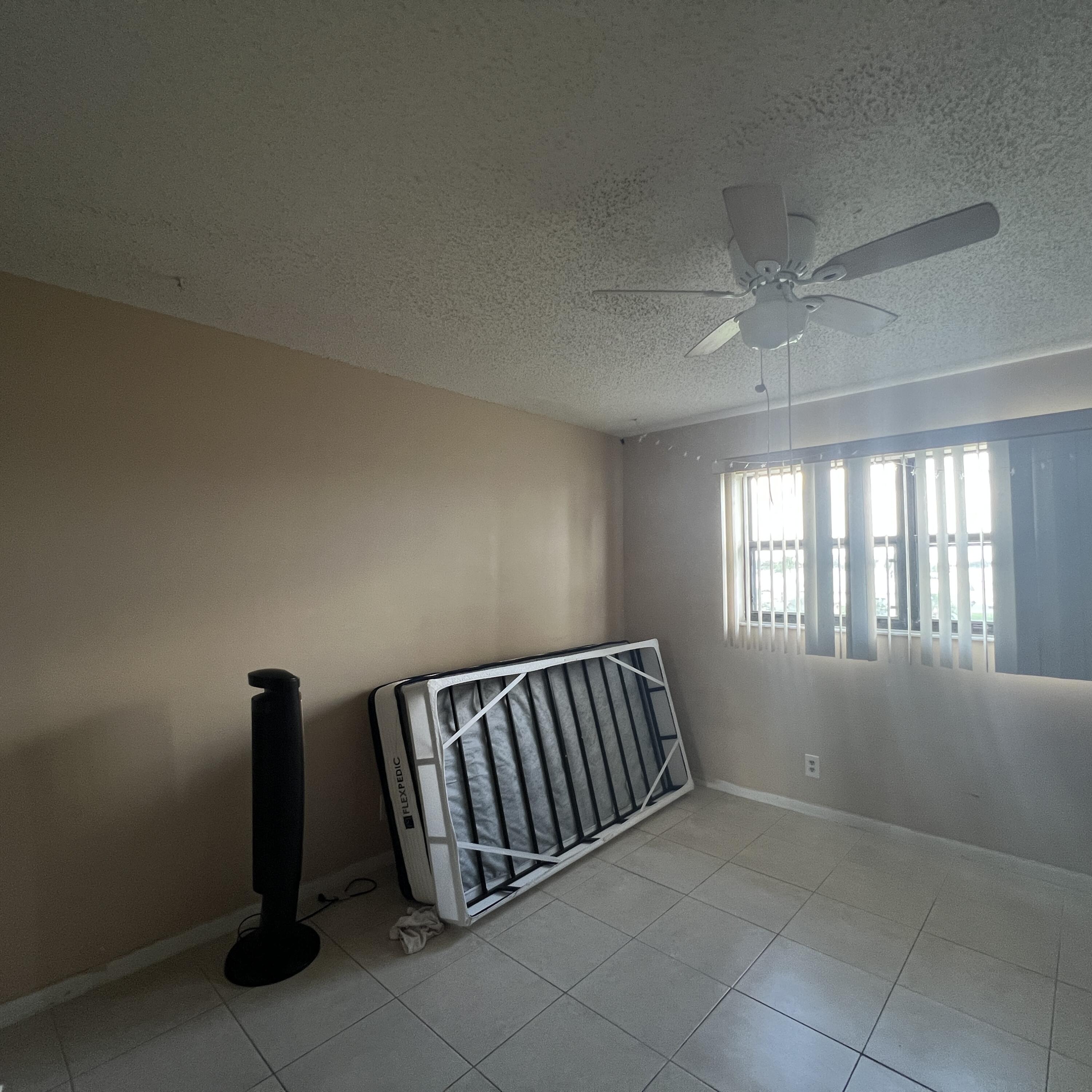 2141 Woolbright Road, Unit L204 Boynton Beach, FL 33426 - Photo 13 of 18 an empty room with windows