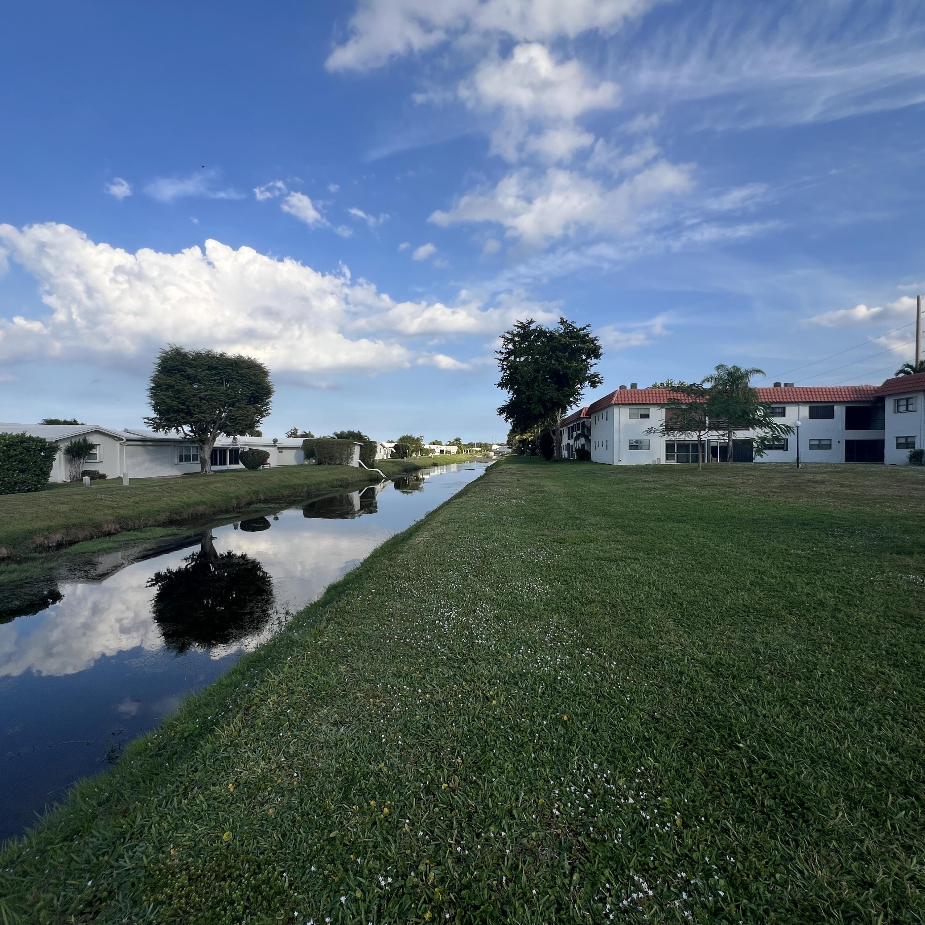 2141 Woolbright Road, Unit L204 Boynton Beach, FL 33426 - Photo 15 of 18 a view of a garden