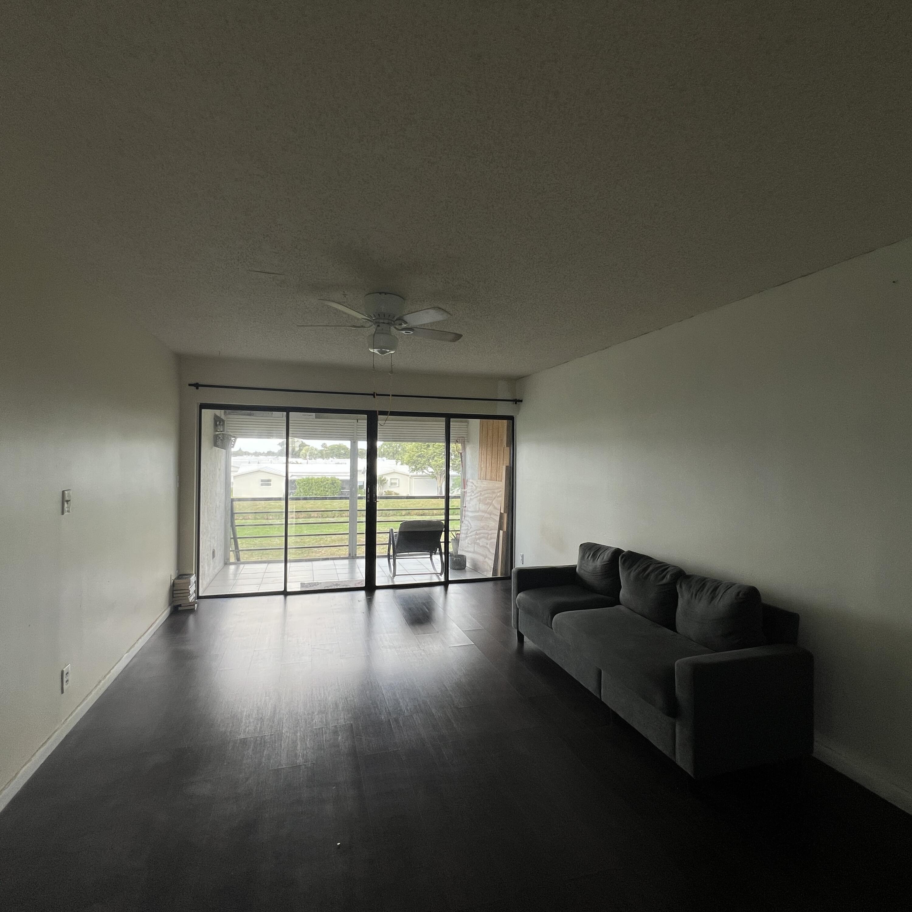 2141 Woolbright Road, Unit L204 Boynton Beach, FL 33426 - Photo 8 of 18 wooden floor in an empty room with a window