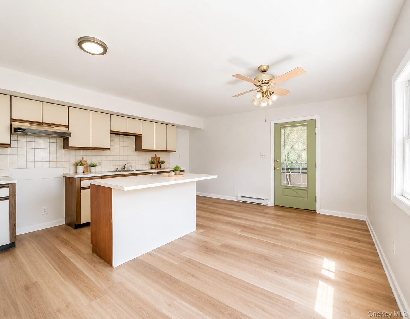 55 Hasbrouck A Road Fallsburg, NY 12759 - Photo 3 of 8 a view of kitchen with sink and wooden floor
