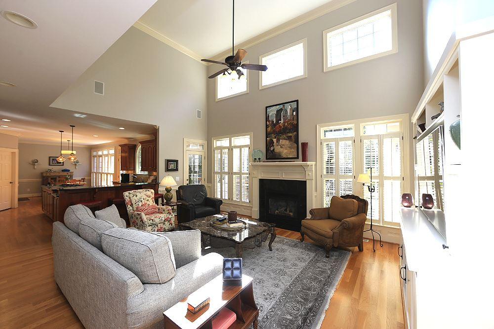 Spacious Family Room with Vaulted ceilings and incredible wooded view out back. Mounted Sonos speakers here provide just the right touch with your favorite music. Family Room