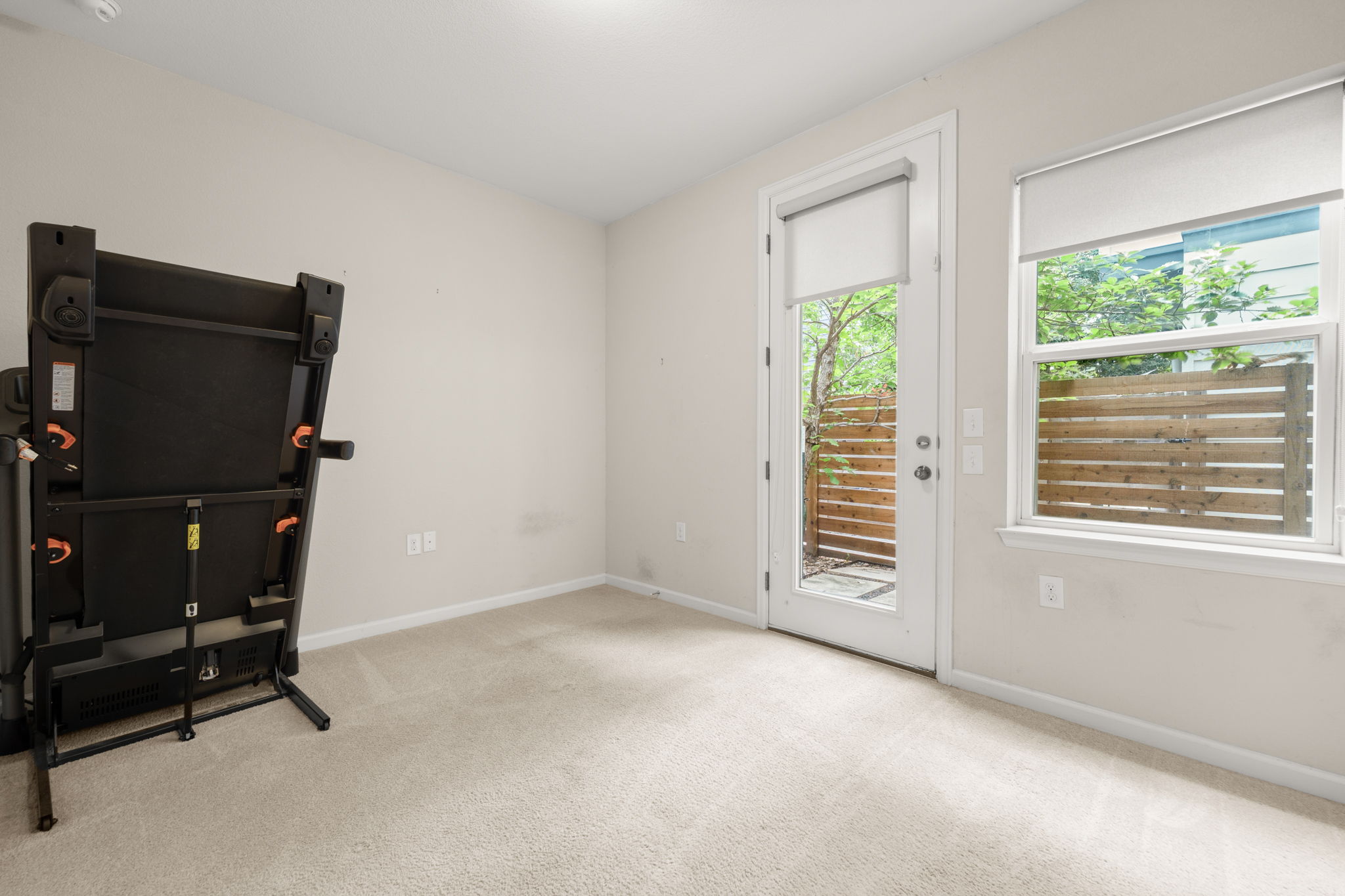 4403 Swift Path Austin, TX 78741 - Photo 22 of 32 Light-colored carpeting and neutral wall paint create a bright interior