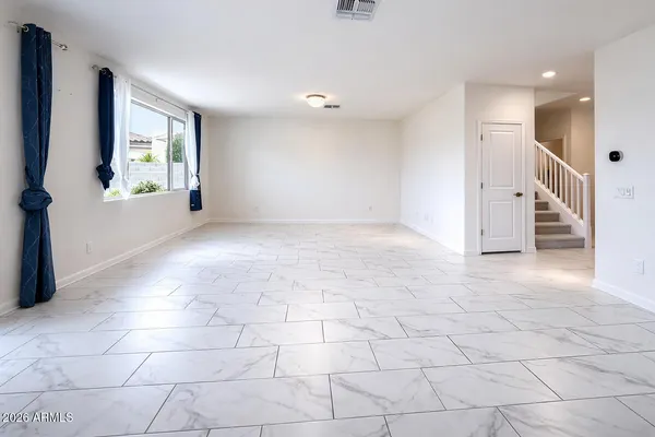 a view of an empty room and window