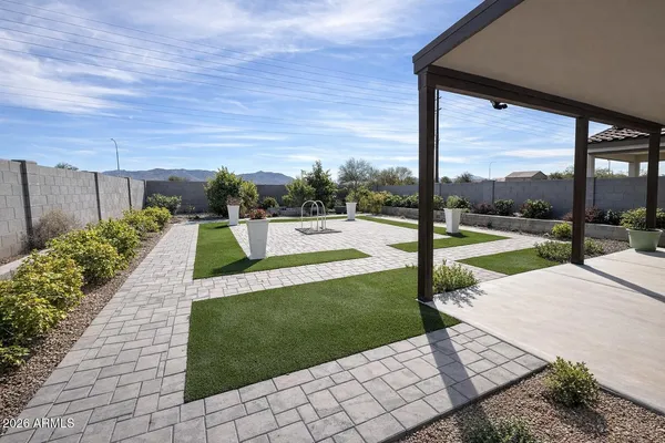 a view of a patio with a yard