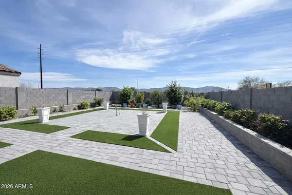 a view of a patio with swimming pool