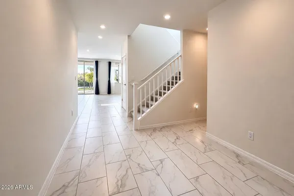 a view of an entryway with wooden floor