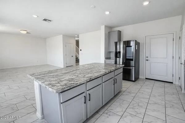 a kitchen with stainless steel appliances granite countertop a sink and cabinets