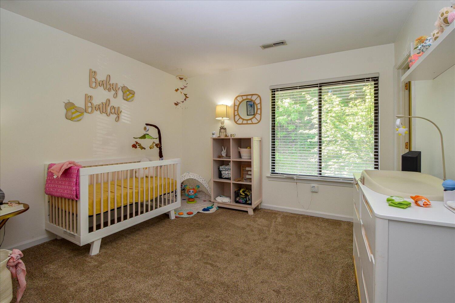 3279 Forest Ridge Road Roanoke, VA 24018 - Photo 8 of 21 a bedroom with baby crib and a window