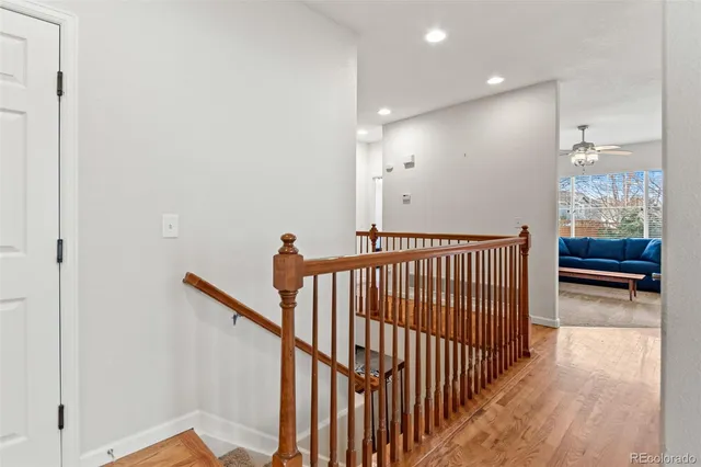 a kitchen with stainless steel appliances granite countertop a stove refrigerator and dishwasher with wooden floor