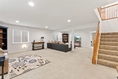 a picture of a bench in front of a wall