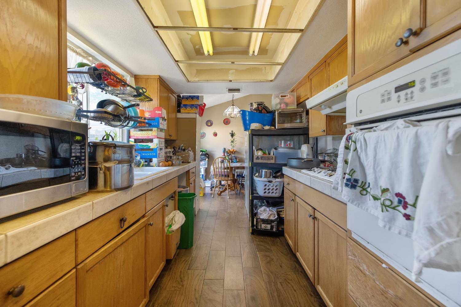 709 Ashlan Way Madera, CA 93638 - Photo 11 of 23 a kitchen with stainless steel appliances granite countertop lots of counter top space