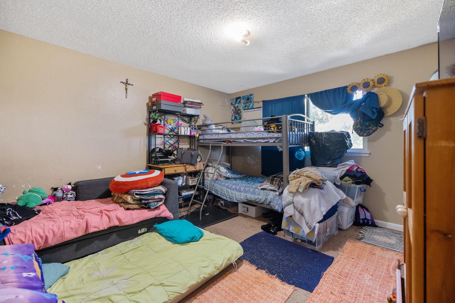 709 Ashlan Way Madera, CA 93638 - Photo 16 of 23 a living room with furniture and a couch