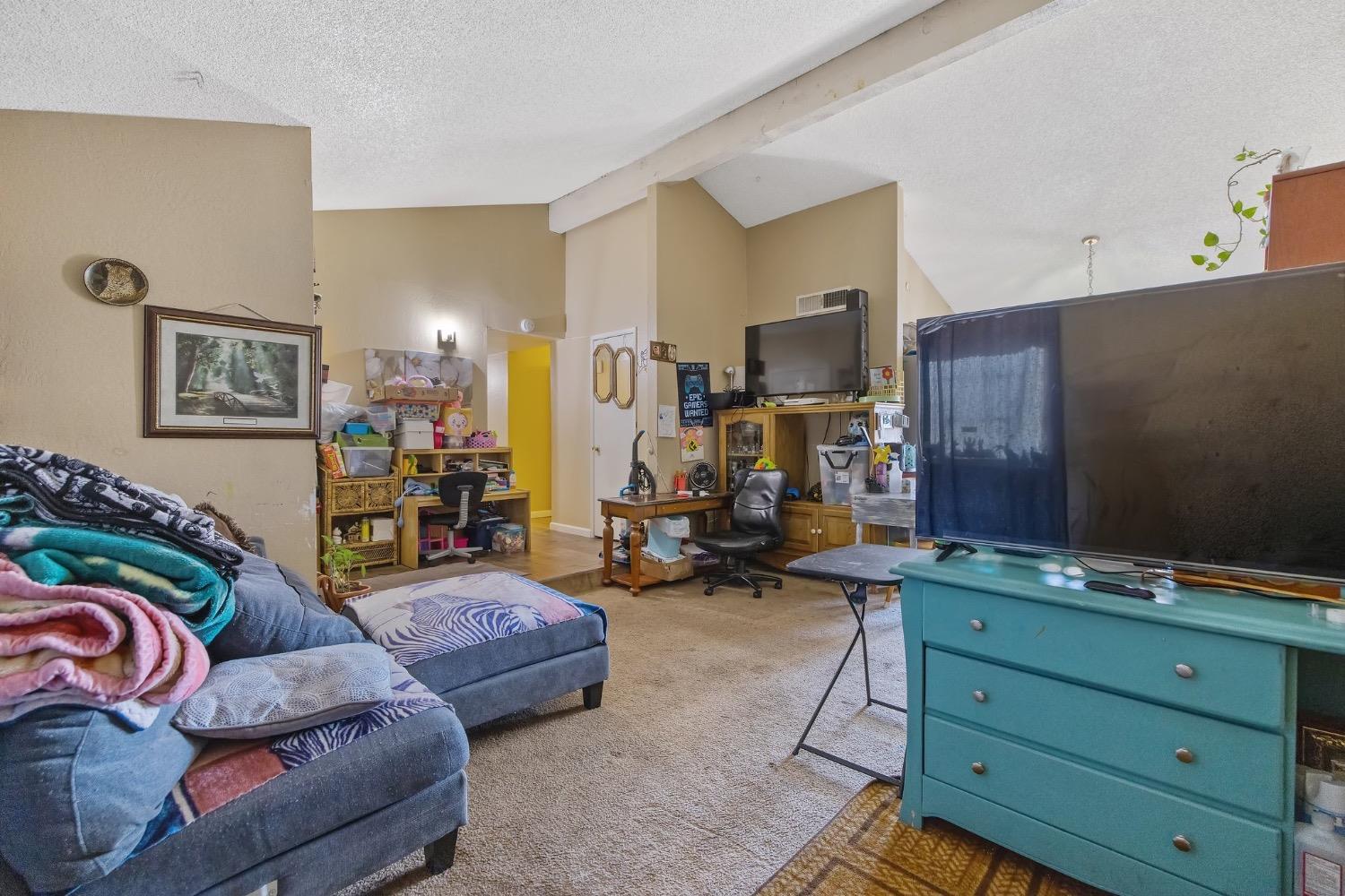 709 Ashlan Way Madera, CA 93638 - Photo 6 of 23 a living room with furniture and gym equipment