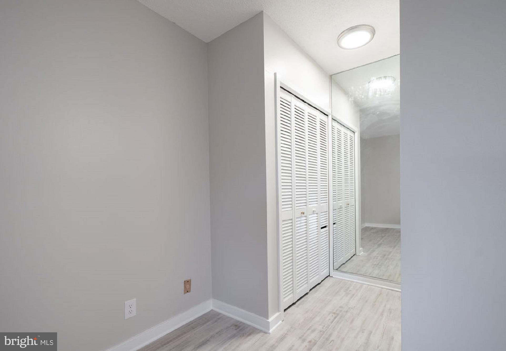 5505 Seminary Road, Unit 103N Falls Church, VA 22041 - Photo 26 of 59 an entryway of a room with wooden floor and windows