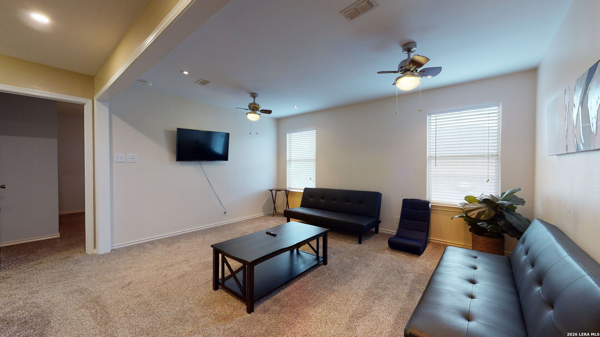5614 Spring Quail San Antonio, TX 78247 - Photo 24 of 43 a living room with furniture and a flat screen tv