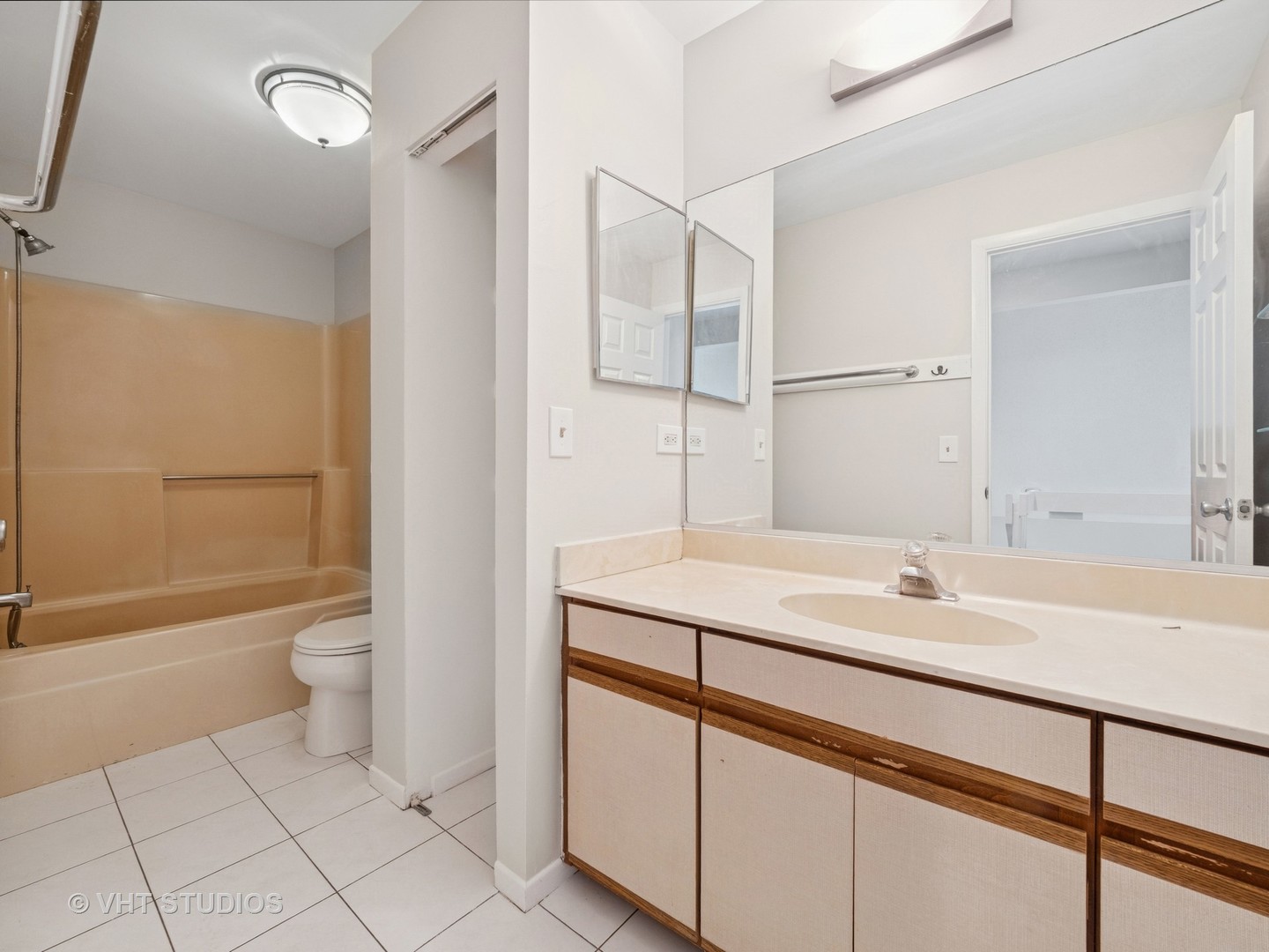 1102 North Knollwood Drive Palatine, IL 60067 - Photo 13 of 15 a bathroom with a sink a toilet and shower