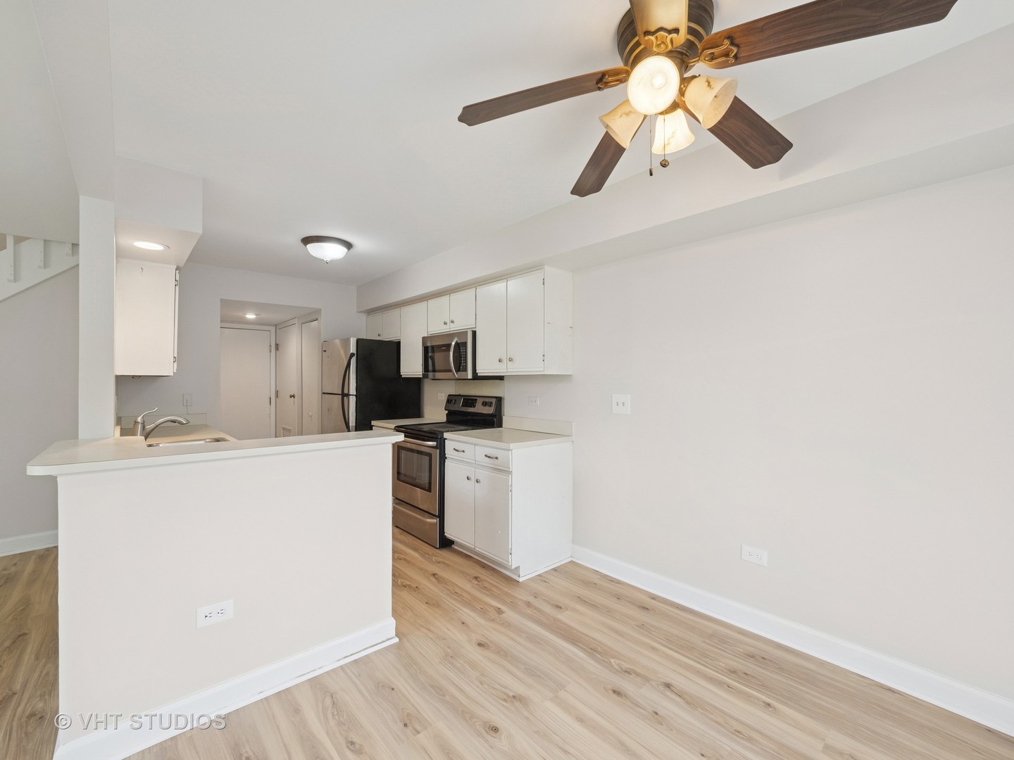 1102 North Knollwood Drive Palatine, IL 60067 - Photo 6 of 15 a kitchen with stainless steel appliances a white stove top oven a sink dishwasher and a refrigerator
