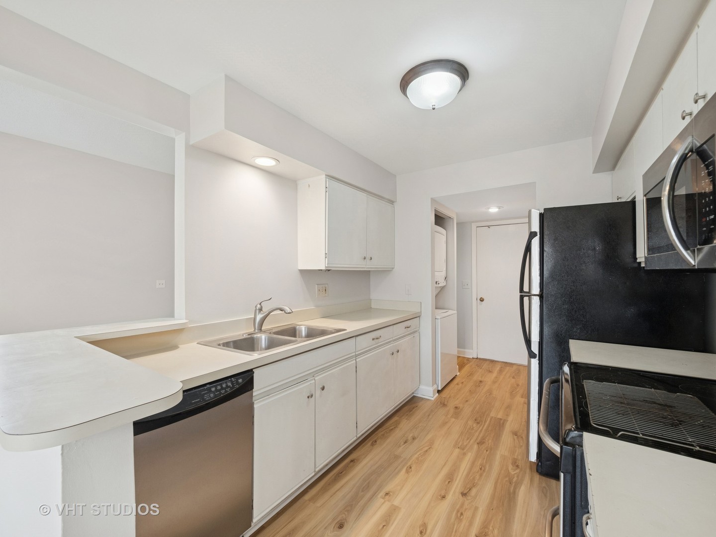 1102 North Knollwood Drive Palatine, IL 60067 - Photo 7 of 15 a kitchen with a sink appliances and cabinets