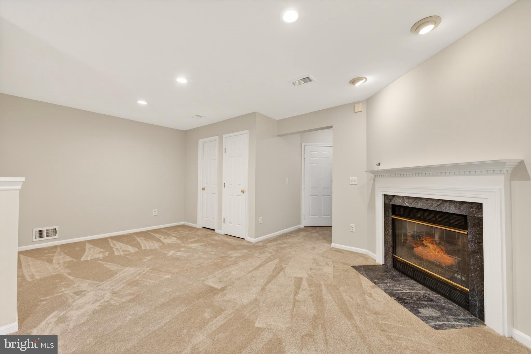1409 Park Garden Lane Reston, VA 20194 - Photo 30 of 41 a view of empty room with a fireplace