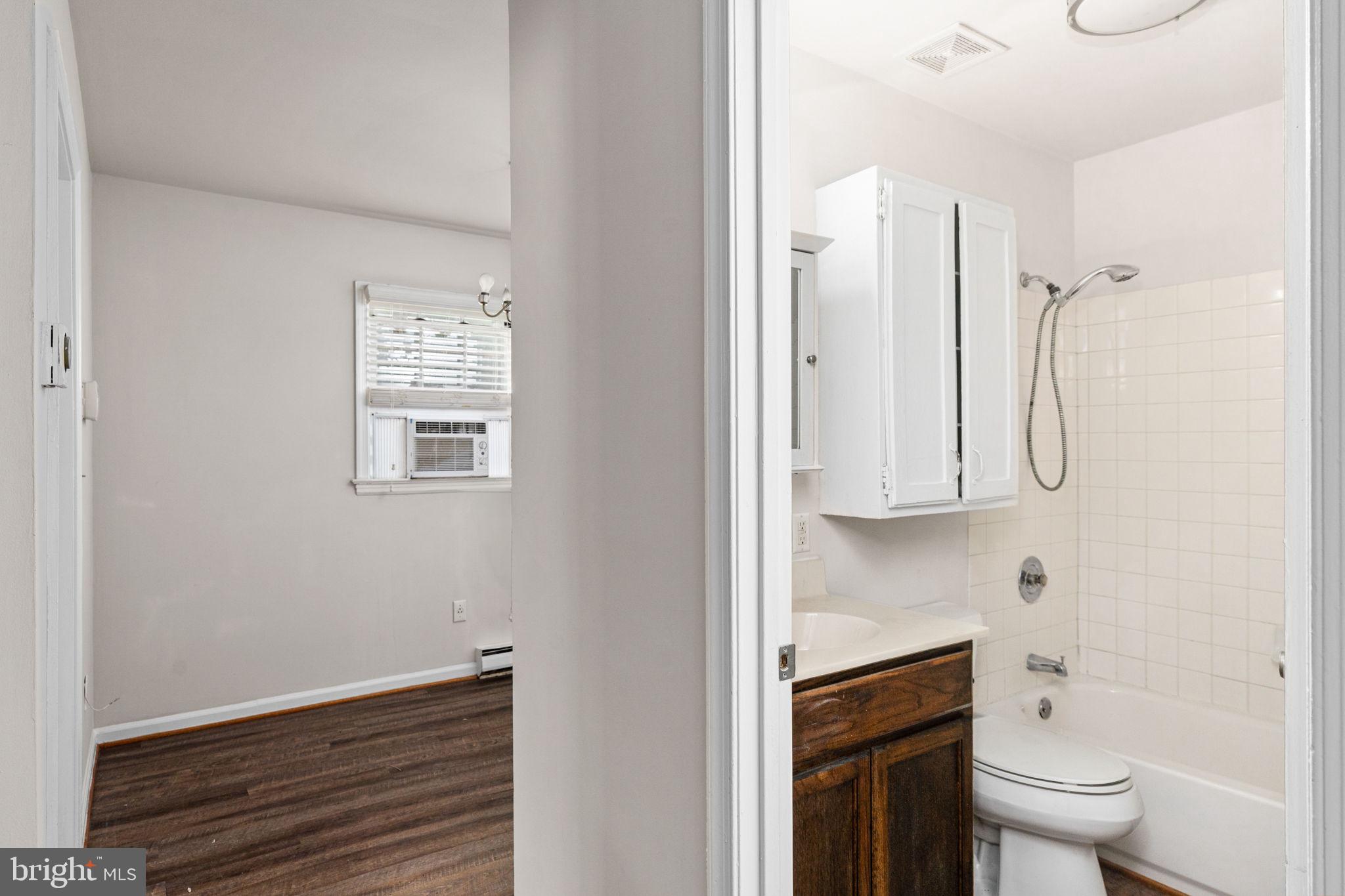 14208 Springfield Lane King George, VA 22485 - Photo 15 of 41 a bathroom with a toilet sink and mirror