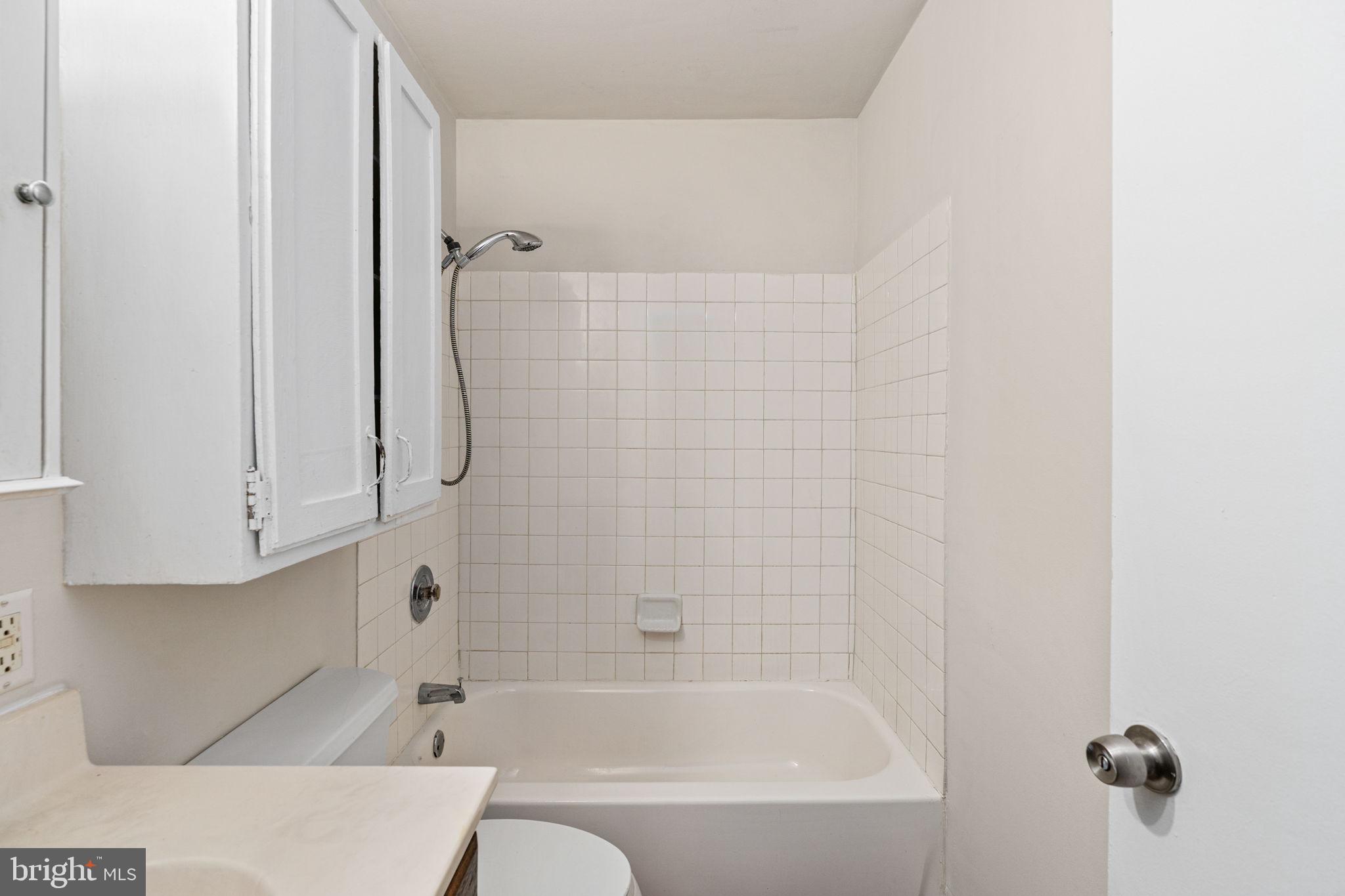 14208 Springfield Lane King George, VA 22485 - Photo 16 of 41 a bathroom with a bathtub and a shower