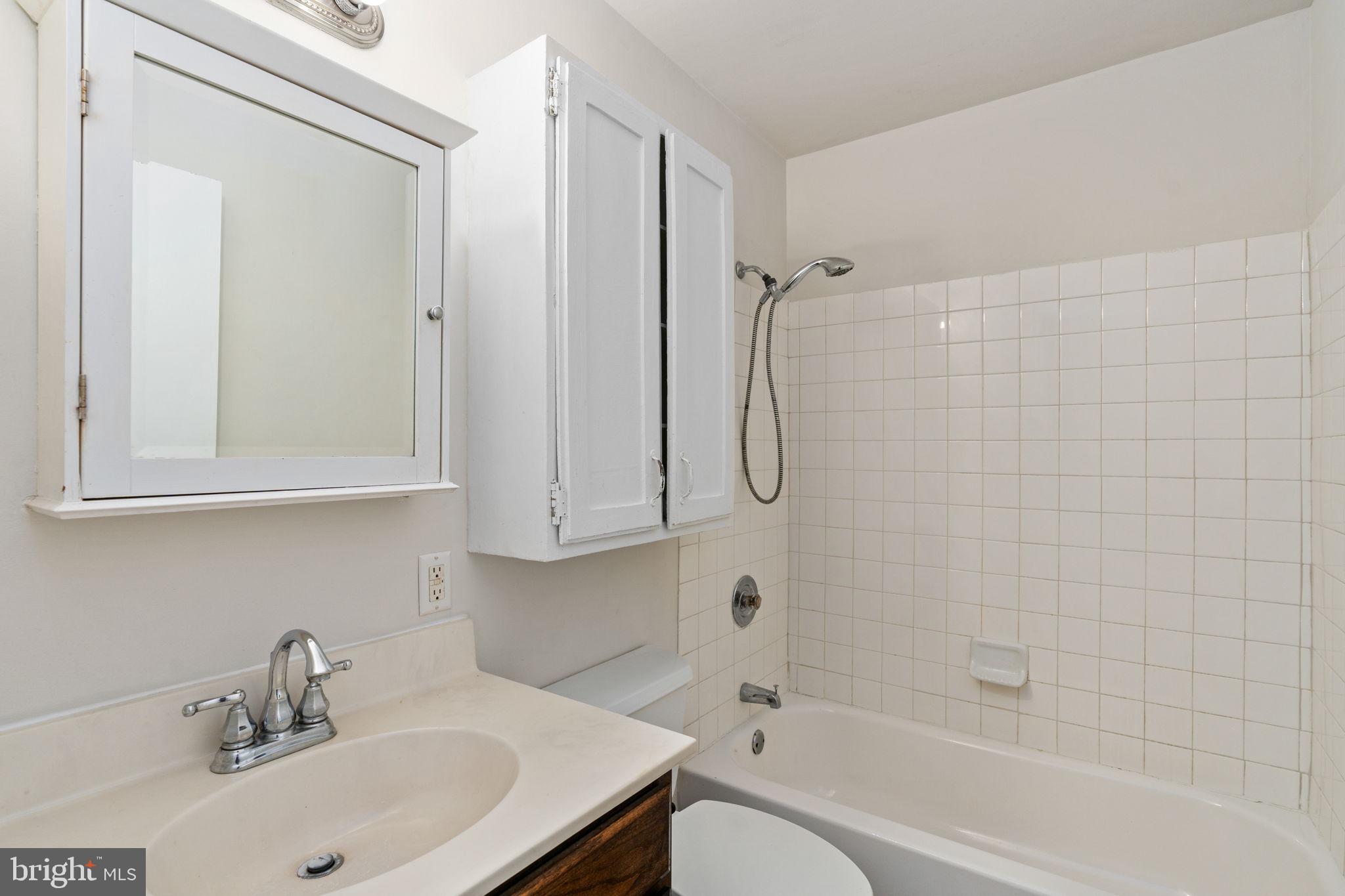14208 Springfield Lane King George, VA 22485 - Photo 17 of 41 a bathroom with a sink a toilet and shower