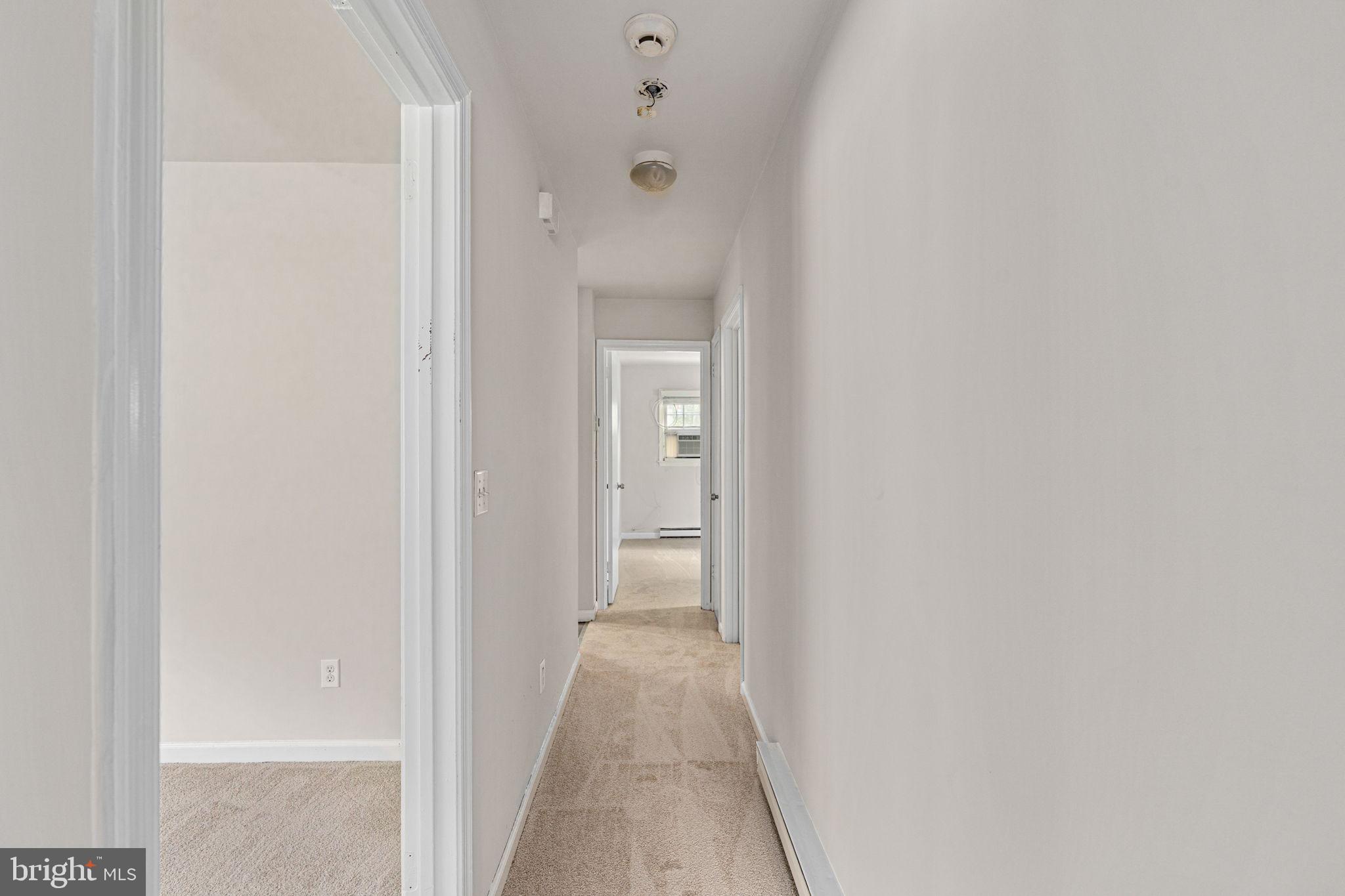 14208 Springfield Lane King George, VA 22485 - Photo 19 of 41 a view of a hallway with a white walls