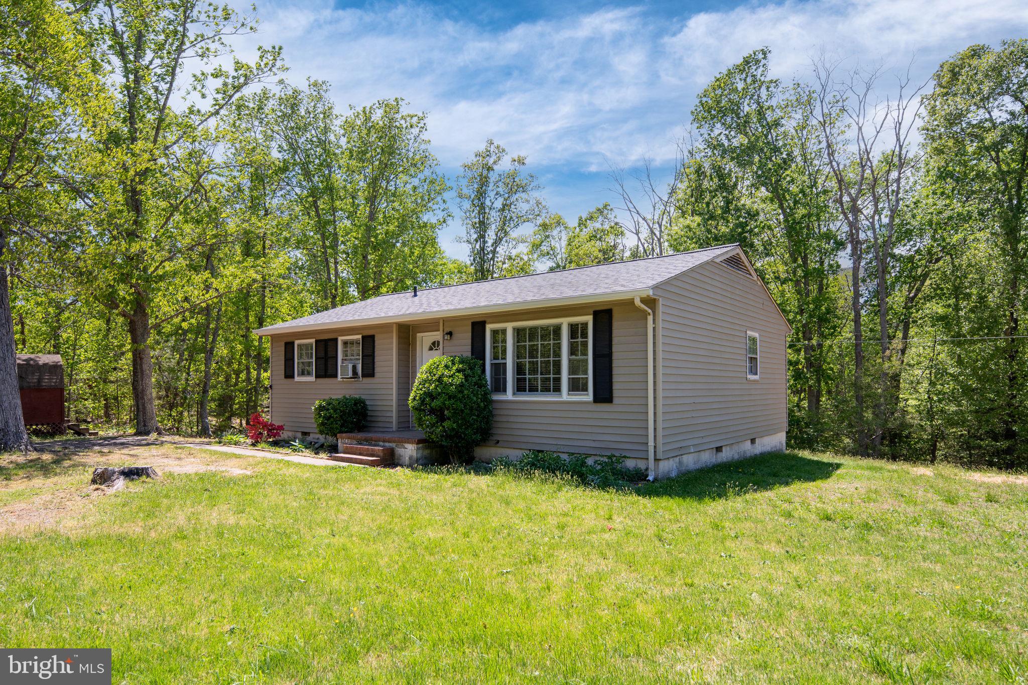 14208 Springfield Lane King George, VA 22485 - Photo 28 of 41 a view of an house with backyard space and garden