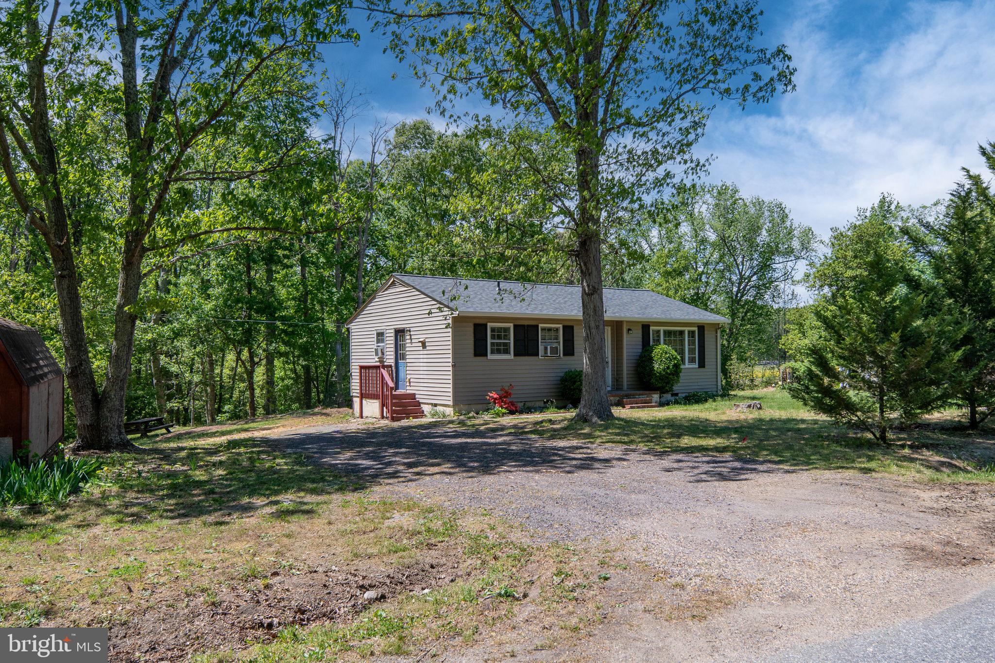 14208 Springfield Lane King George, VA 22485 - Photo 30 of 41 a view of a house with a yard and large trees