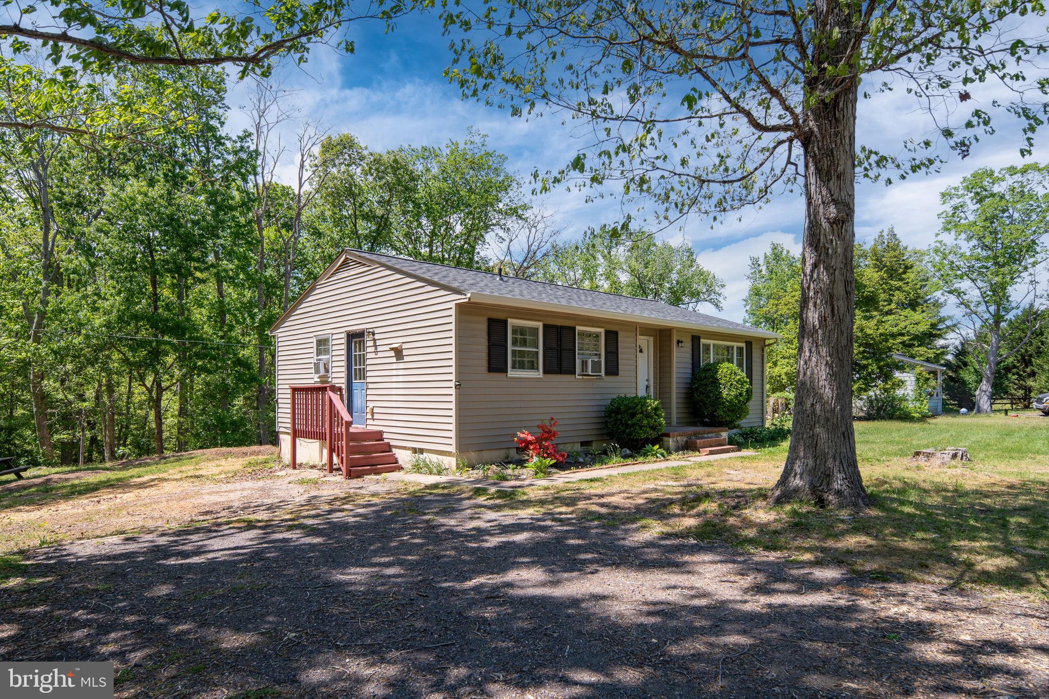 14208 Springfield Lane King George, VA 22485 - Photo 31 of 41 a front view of a house with a yard and tree