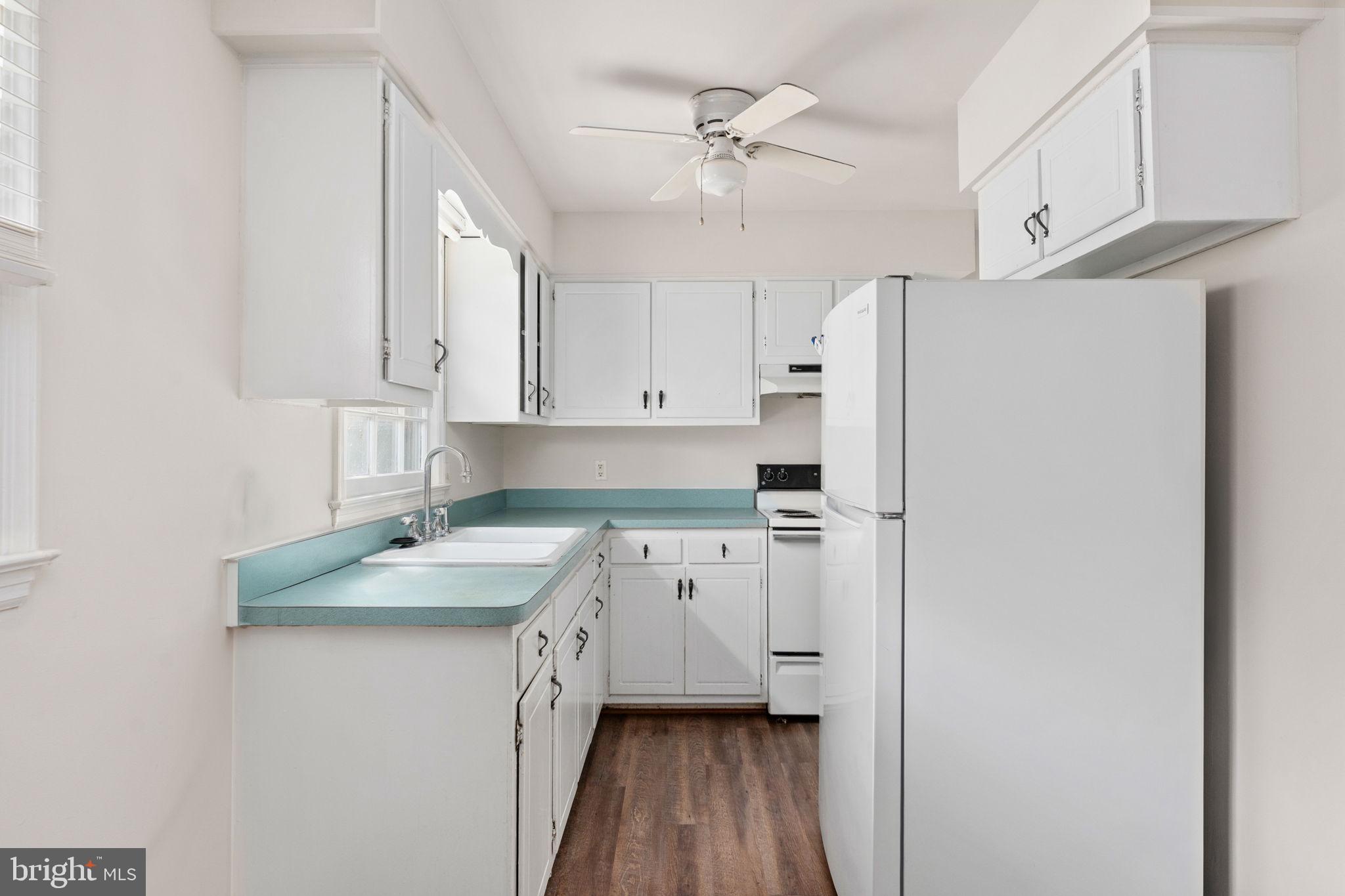 14208 Springfield Lane King George, VA 22485 - Photo 10 of 41 a kitchen with a sink a stove a refrigerator and cabinets