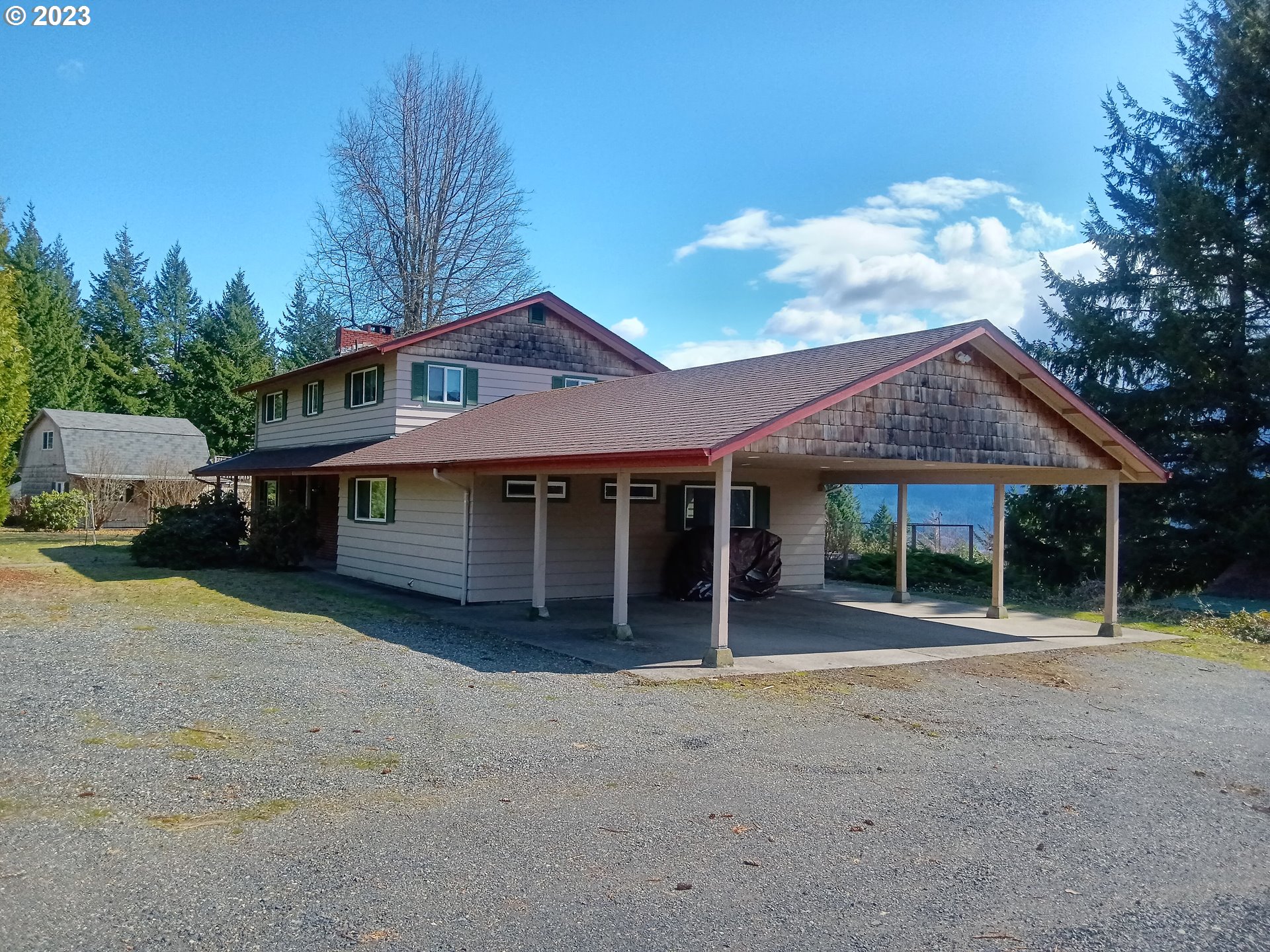 51 Stewart Road Stevenson, WA 98648 - Photo 12 of 30 a front view of a house with a garden and trees