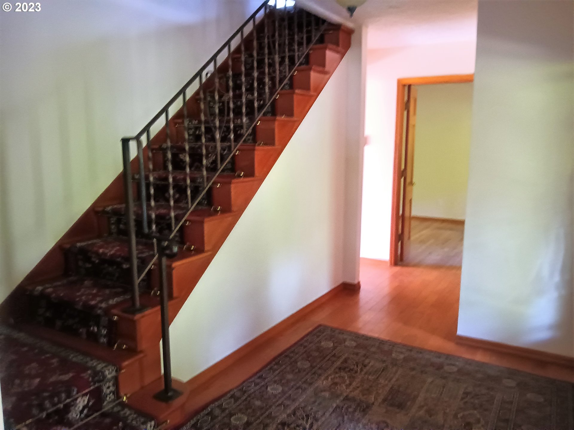 51 Stewart Road Stevenson, WA 98648 - Photo 16 of 30 a view of a hallway with wooden floor and stairs