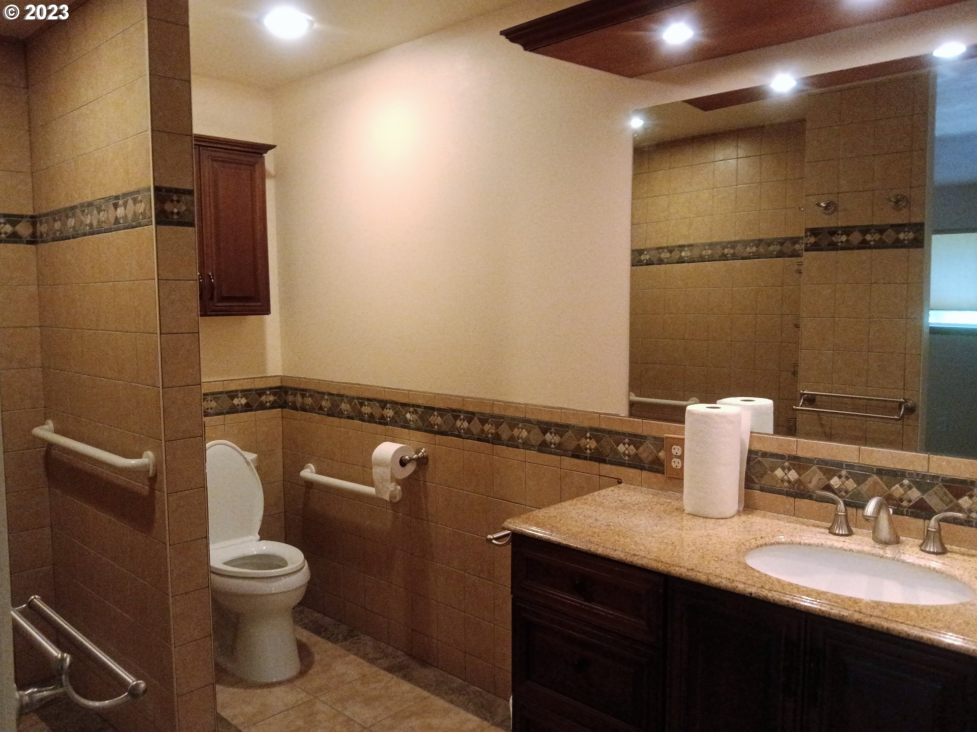 51 Stewart Road Stevenson, WA 98648 - Photo 21 of 30 a bathroom with a granite countertop sink toilet and a mirror