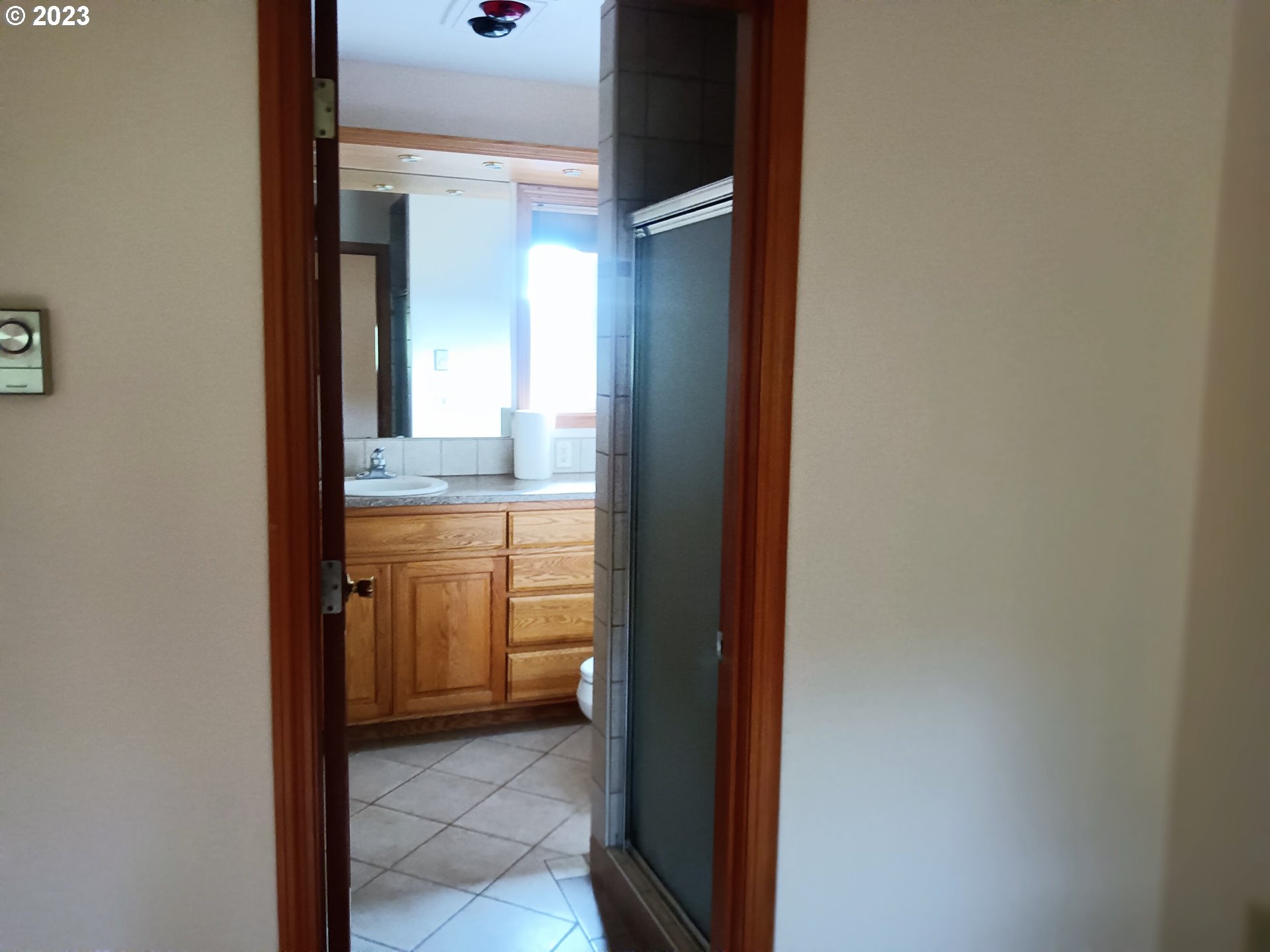 51 Stewart Road Stevenson, WA 98648 - Photo 28 of 30 a bathroom with a granite countertop sink and a mirror