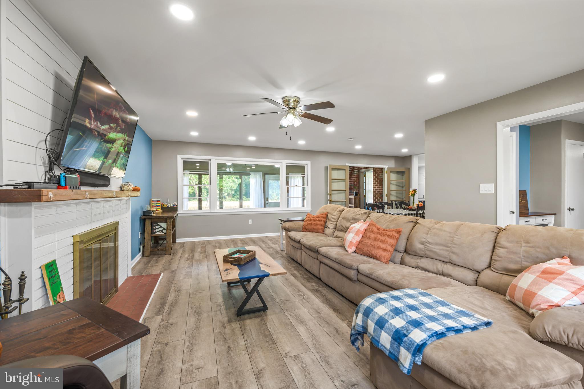 376 Griscom Drive Mannington, NJ 08079 - Photo 12 of 48 a living room with furniture and a fireplace