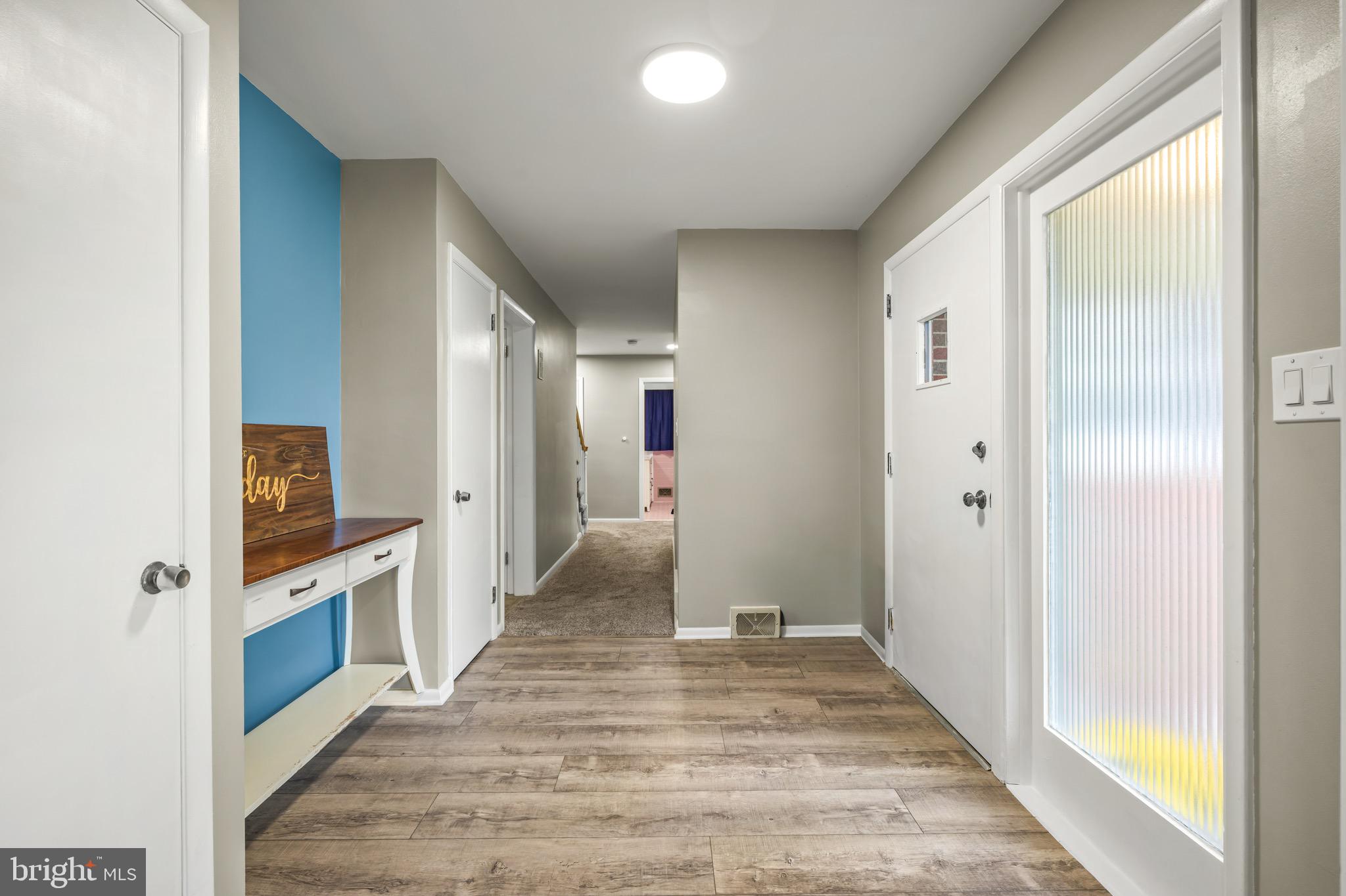 376 Griscom Drive Mannington, NJ 08079 - Photo 16 of 48 a view of a hallway with wooden floor and staircase