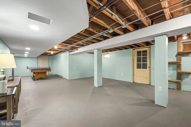 a view of an empty room with windows