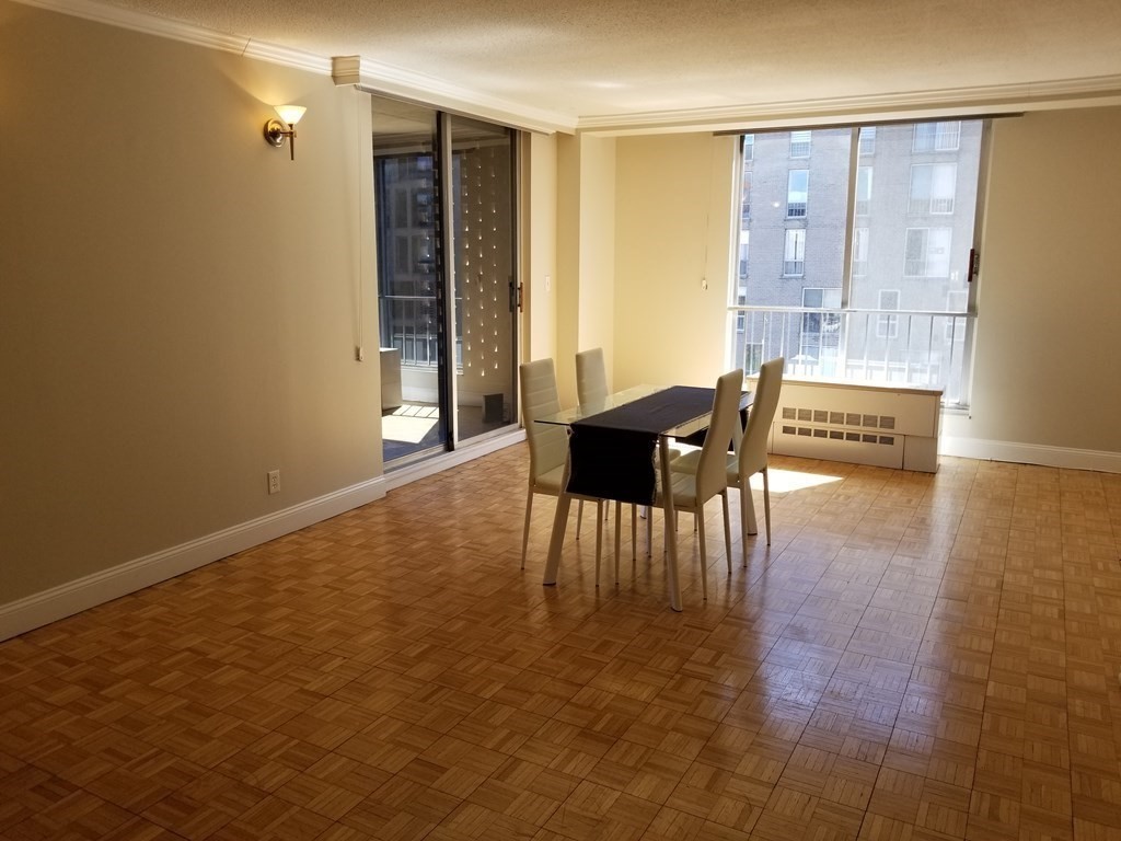 44 Washington Street, Unit 601 Brookline, MA 02445 - Photo 3 of 24 a view of a livingroom with furniture and wooden floor