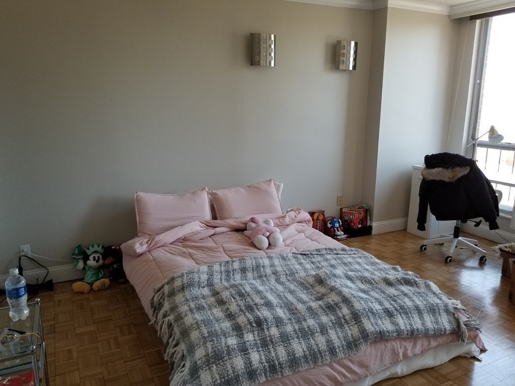 44 Washington Street, Unit 601 Brookline, MA 02445 - Photo 6 of 24 a bedroom with bed and a window