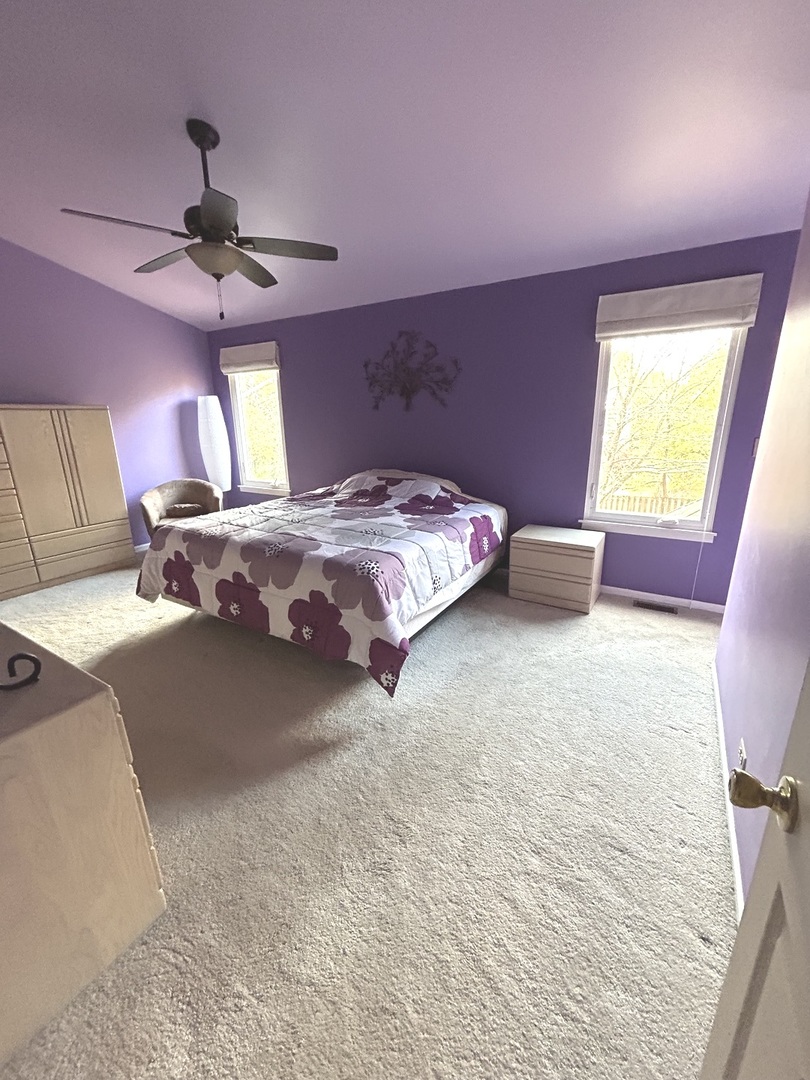620 Old Oak Circle Algonquin, IL 60102 - Photo 16 of 29 a bedroom with a bed and a chandelier