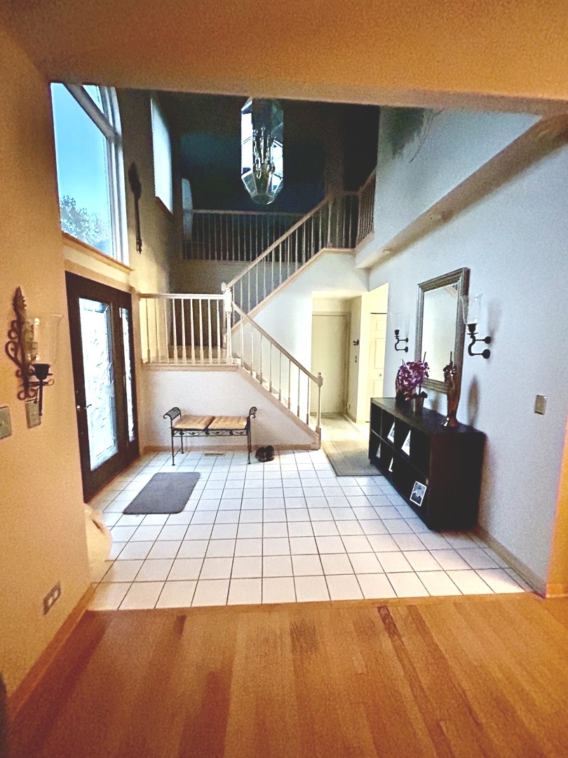 620 Old Oak Circle Algonquin, IL 60102 - Photo 5 of 29 a bed room with a bed and a chandelier