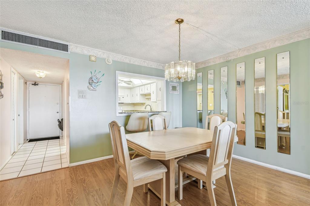 17920 Gulf Boulevard, Unit 208 Redington Shores, FL 33708 - Photo 20 of 98 a view of a dining room with furniture window and wooden floor